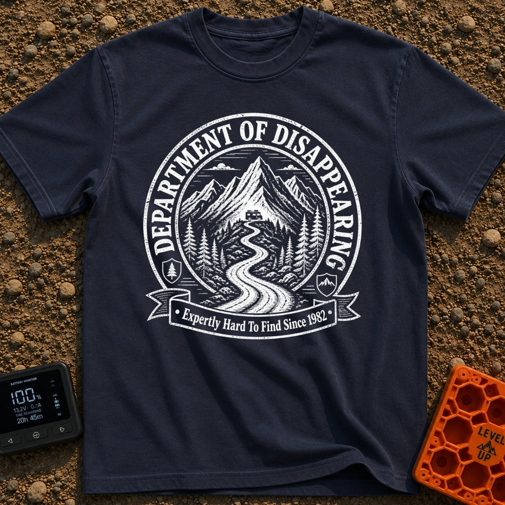 Chief Disappearing Officer - T-Shirt in Navy - A black and white circular badge illustration showing a camper van parked...