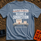 Destinations Are Suggestions - T-Shirt in Blue Jean - A folding camp table holds a coffee mug with a mountain graphic and...