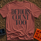 Every Detour Counts - T-Shirt in Brick - Large, stacked serif text reading "DETOURS COUNT TOO" positioned above a small,...