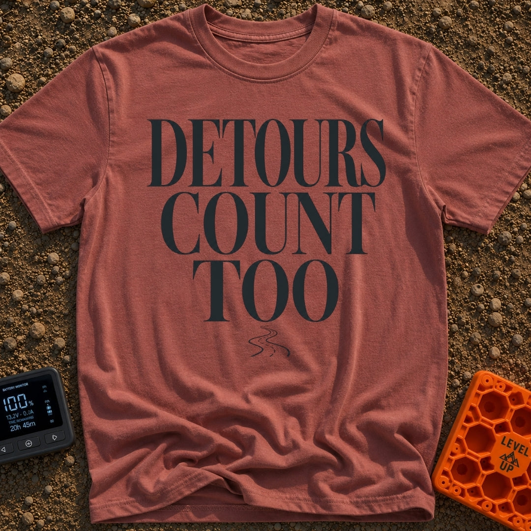 Every Detour Counts - T-Shirt in Brick - Large, stacked serif text reading "DETOURS COUNT TOO" positioned above a small,...