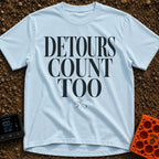 Every Detour Counts - T-Shirt in Chambray - Large, stacked serif text reading "DETOURS COUNT TOO" positioned above a...