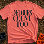 Every Detour Counts - T-Shirt in Watermelon - Large, stacked serif text reading "DETOURS COUNT TOO" positioned above a...