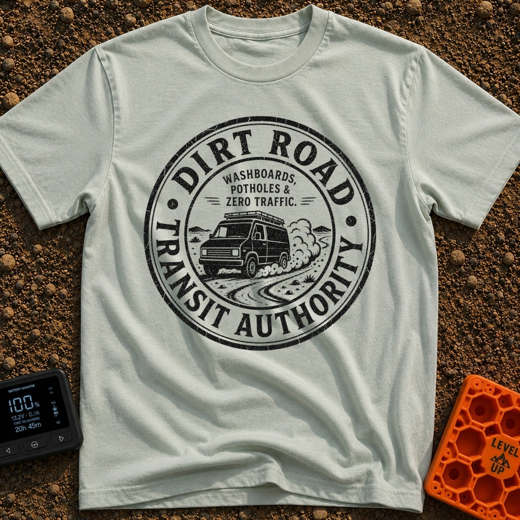 Dirt Road Commuter - T-Shirt in Bay - A circular distressed-style badge featuring a van with a roof rack driving on a...