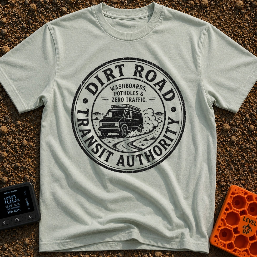 Dirt Road Commuter - T-Shirt in Bay - A circular distressed-style badge featuring a van with a roof rack driving on a...