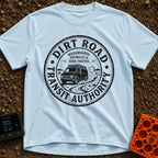 Dirt Road Commuter - T-Shirt in Chambray - A circular distressed-style badge featuring a van with a roof rack driving on...