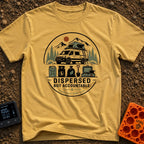 Dispersed But Accountable - T-Shirt in Mustard - A circular badge design featuring a high-clearance camper van with a...