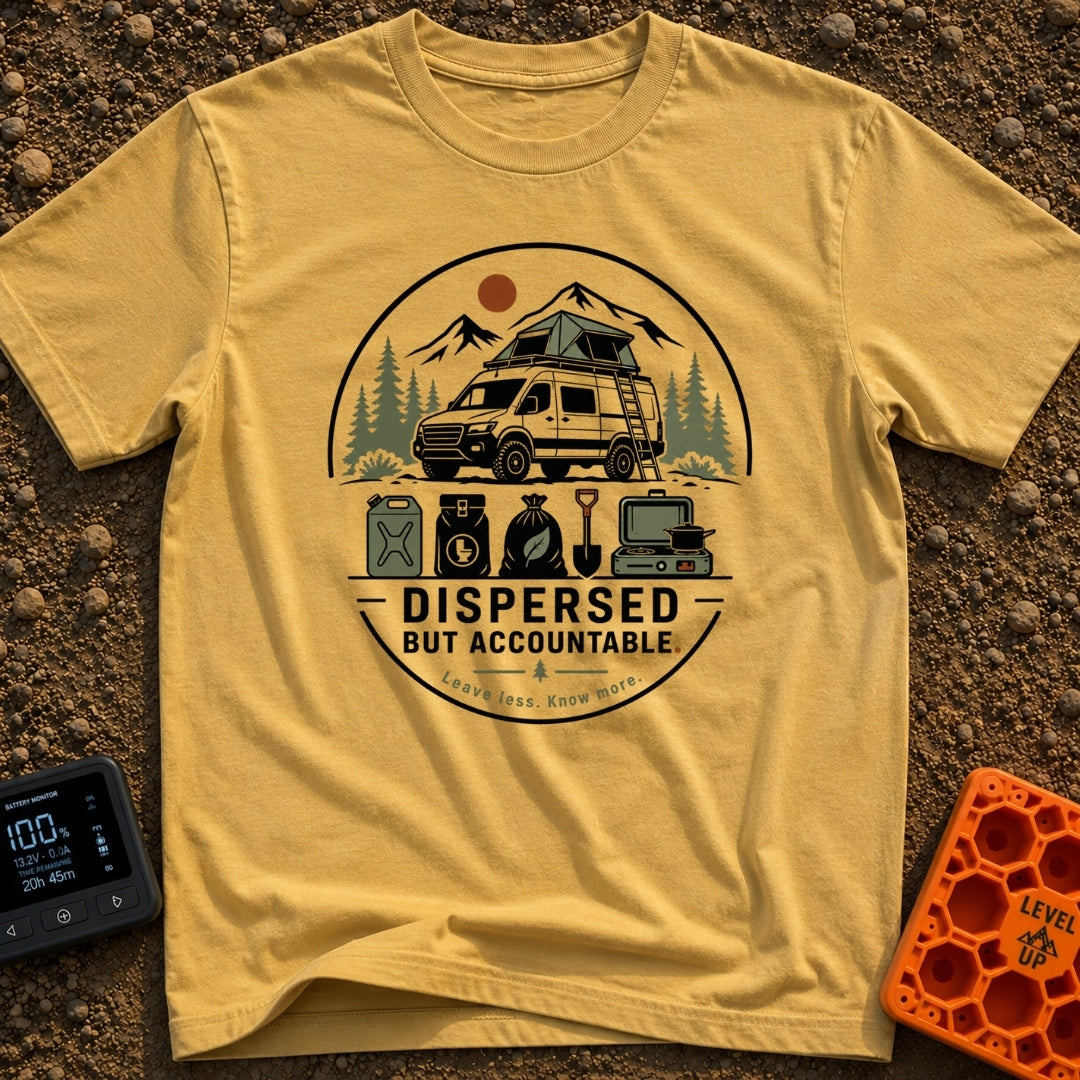 Dispersed But Accountable - T-Shirt in Mustard - A circular badge design featuring a high-clearance camper van with a...