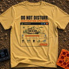 Do Not Disturb Updating - T-Shirt in Mustard - A graphic styled like a computer window titled "CAMPSITE OS" showing a...