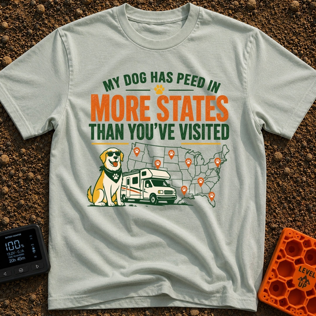 Marked In More States - T-Shirt in Bay - A cartoon dog wearing sunglasses and a bandana sits next to a Class C motorhome,...
