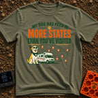 Marked In More States - T-Shirt in Moss - A cartoon dog wearing sunglasses and a bandana sits next to a Class C...