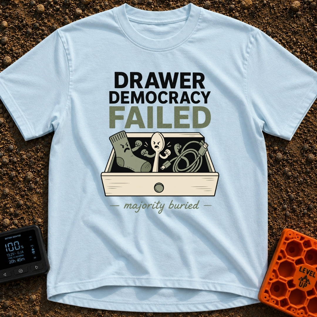The Drawers Have Spoken - T-Shirt in Chambray - A cartoon illustration of an open wooden drawer containing an angry sock,...