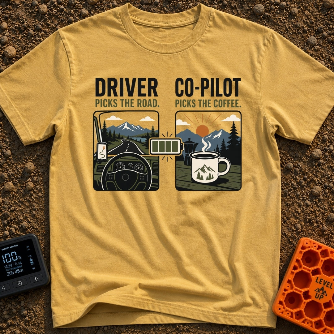 Co-Pilot's Brew Code - T-Shirt in Mustard - A split-panel design showing a steering wheel and dashboard looking out at a...