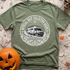 Dust Collector Inc - T-Shirt in Moss - A black-and-white circular badge illustration of a heavy-duty expedition camper...