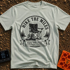 Earn Your Camp Chair - T-Shirt in Bay - A black and white circular graphic featuring a folding camp chair and a pair of...