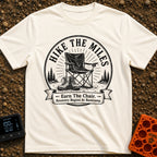 Earn Your Camp Chair - T-Shirt in Ivory - A black and white circular graphic featuring a folding camp chair and a pair of...