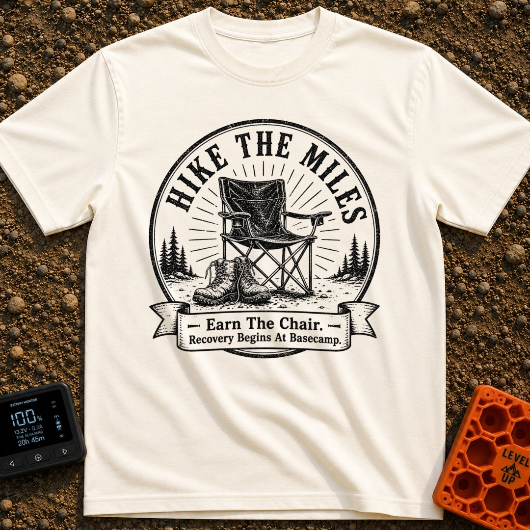 Earn Your Camp Chair - T-Shirt in Ivory - A black and white circular graphic featuring a folding camp chair and a pair of...