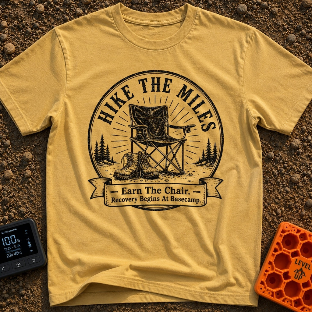 Earn Your Camp Chair - T-Shirt in Mustard - A black and white circular graphic featuring a folding camp chair and a pair...