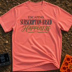 Cancel My Subscription - T-Shirt in Watermelon - A text-based design reading "ESCAPING SUBSCRIPTION-BASED HAPPINESS" in a...