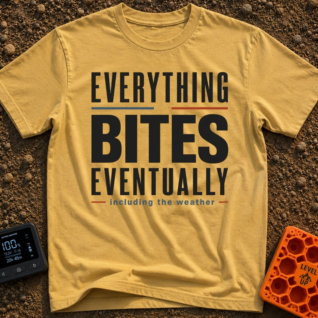 Eventually, It Bites - T-Shirt in Mustard - A text-only design reading "EVERYTHING BITES EVENTUALLY" in bold black,...