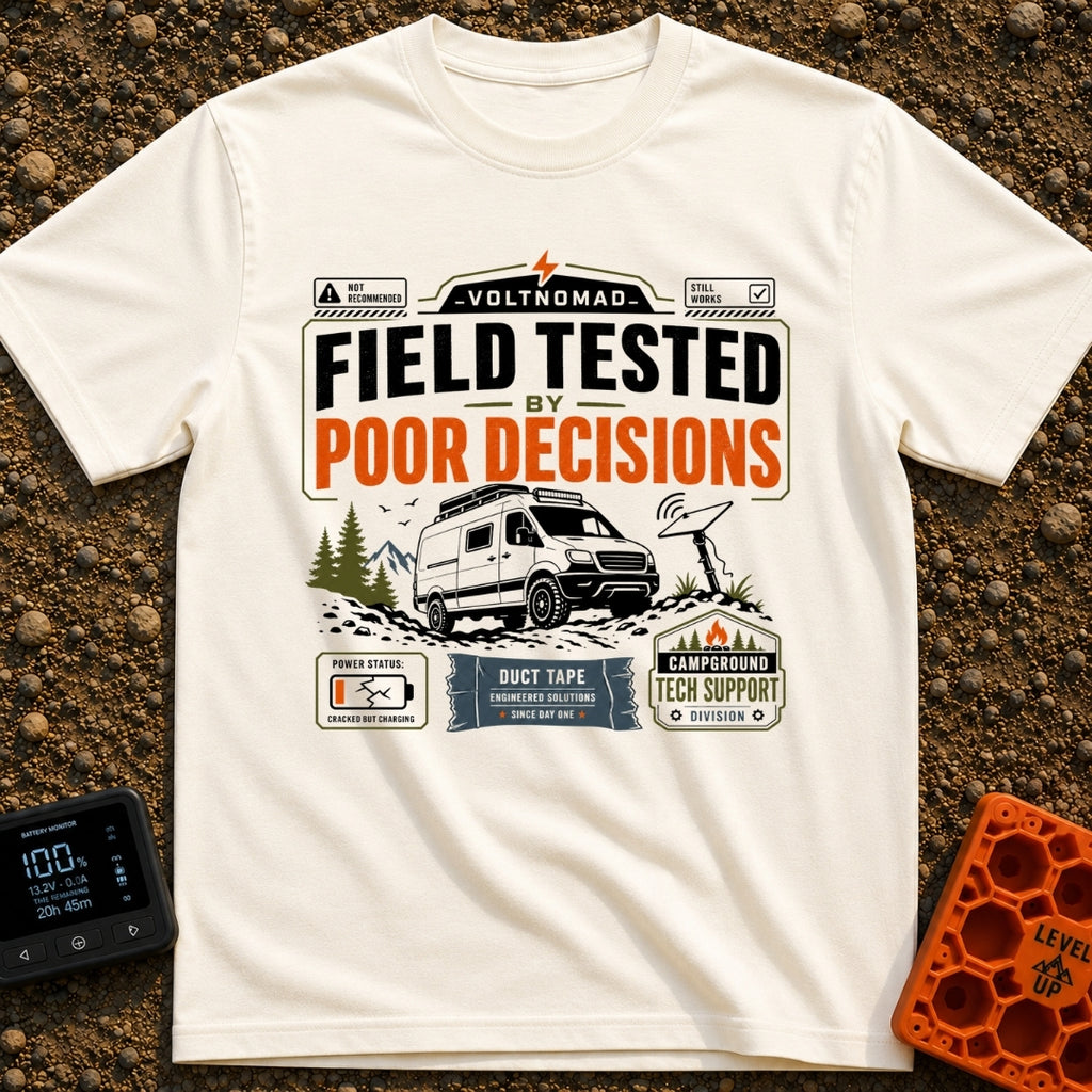 Tested By Poor Decisions - T-Shirt in Ivory - The design features a camper van parked on rocky terrain with mountains and...