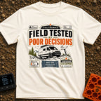Tested By Poor Decisions - T-Shirt in Ivory - The design features a camper van parked on rocky terrain with mountains and...