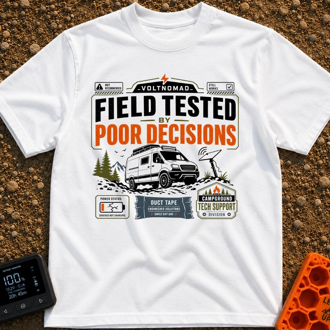 Tested By Poor Decisions - T-Shirt in White - The design features a camper van parked on rocky terrain with mountains and...