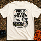 Tested In Dead Zones - T-Shirt in Ivory - A badge-style illustration showing a white camper van with roof antennas parked...