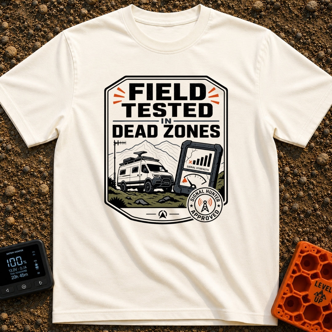 Tested In Dead Zones - T-Shirt in Ivory - A badge-style illustration showing a white camper van with roof antennas parked...