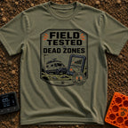 Tested In Dead Zones - T-Shirt in Moss - A badge-style illustration showing a white camper van with roof antennas parked...