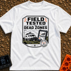 Tested In Dead Zones - T-Shirt in White - A badge-style illustration showing a white camper van with roof antennas parked...