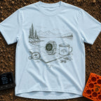 Wander Watch Out - T-Shirt in Chambray - A line drawing showing a GPS watch, a compass, a topographic map, and a steaming...