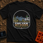 Set Chairs Ignore World - T-Shirt in Black - An illustration of two people sitting in camp chairs holding mugs next to a...