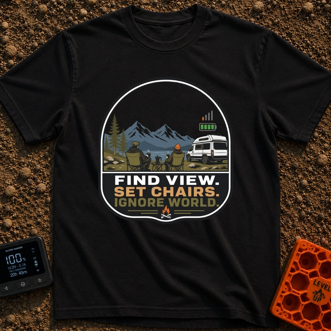 Set Chairs Ignore World - T-Shirt in Black - An illustration of two people sitting in camp chairs holding mugs next to a...