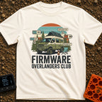 Overland Software Update - T-Shirt in Ivory - A rugged, off-road camper van is parked in a forest setting with a camp...