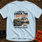 First Check The Battery - T-Shirt in Chambray - A white camper van with a roof-mounted solar panel parked near mountains...