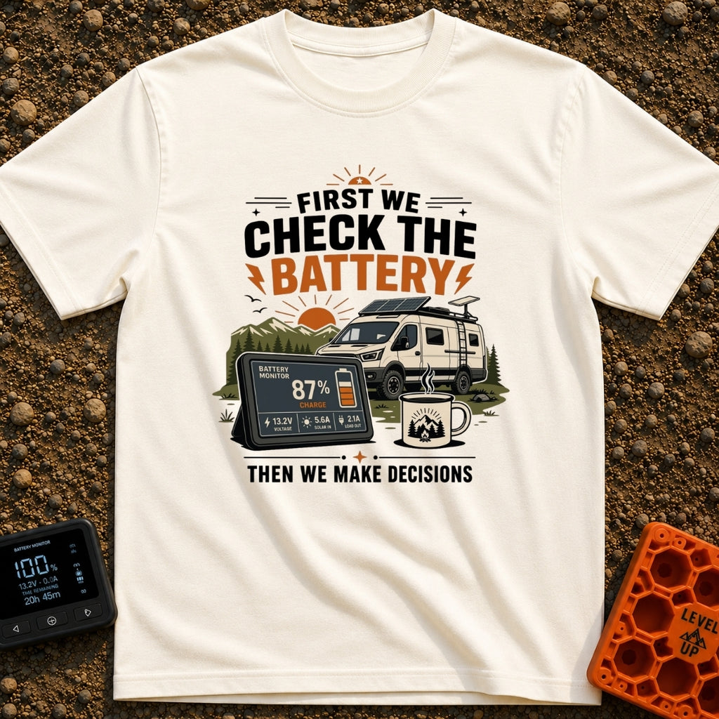 First Check The Battery - T-Shirt in Ivory - A white camper van with a roof-mounted solar panel parked near mountains and...
