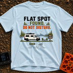 Flat Spot Found - T-Shirt in Chambray - A white camper van parked beside a lake with mountains in the background, next to...