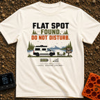 Flat Spot Found - T-Shirt in Ivory - A white camper van parked beside a lake with mountains in the background, next to...