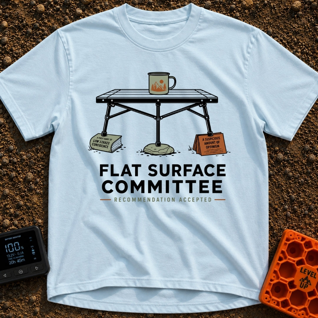 Flat Surface Club - T-Shirt in Chambray - A drawing of a foldable camp table with a green enamel mug on top, whose legs...