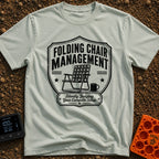Chief Folding Officer - T-Shirt in Bay - A black-and-white badge graphic featuring a vintage webbed folding camp chair...