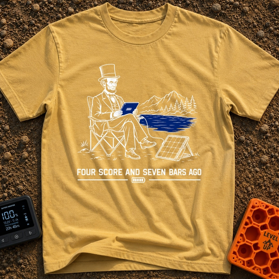 Lincoln Unplugged Adventure - T-Shirt in Mustard - A line drawing of Abraham Lincoln sitting in a folding camp chair by a...