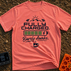 Wired And Tired - T-Shirt in Watermelon - A graphic featuring a sun over mountains flanked by two solar panels, a full...