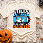 Highly Charged Spirits - T-Shirt in Ivory - A graphic reading "FULLY CHARGED" and "SLIGHTLY HAUNTED" featuring a 100%...