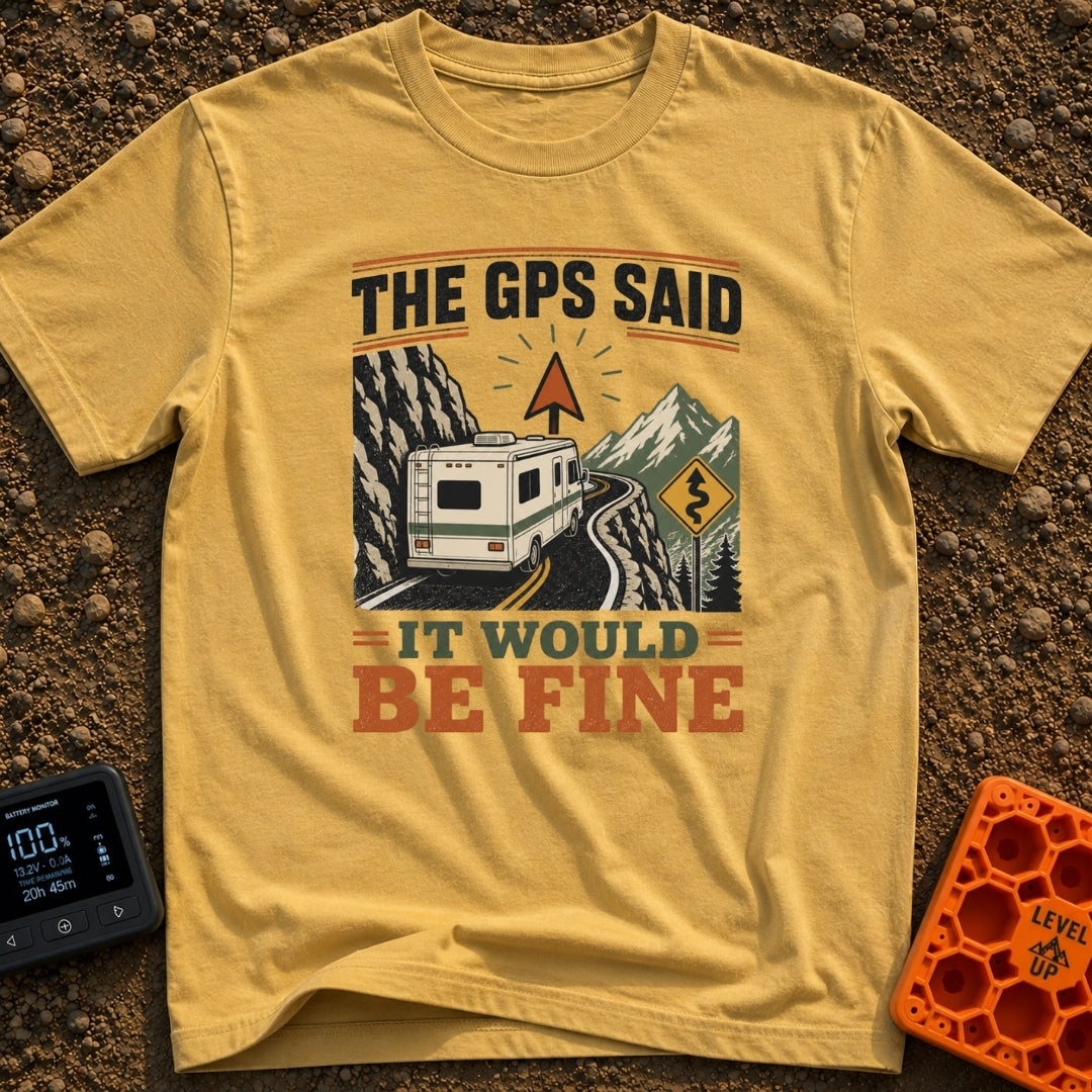 But The GPS Said - T-Shirt in Mustard - A motorhome driving on a narrow, winding mountain road with a steep rock face on...