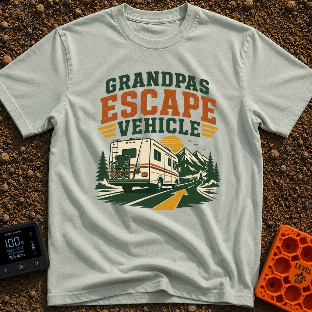 Grandpas Great Escape - T-Shirt in Bay - A vintage-style Class C motorhome drives away down a winding paved road toward a...