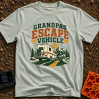 Grandpas Great Escape - T-Shirt in Bay - A vintage-style Class C motorhome drives away down a winding paved road toward a...