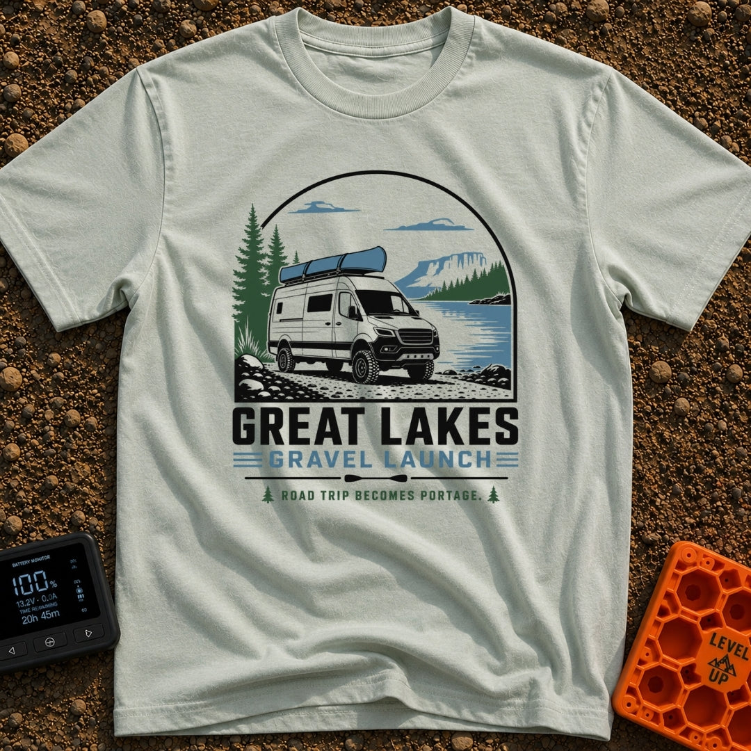 Canoe Venture Vibes - T-Shirt in Bay - A white camper van with a blue canoe strapped to its roof is parked on a gravel...