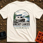 Canoe Venture Vibes - T-Shirt in Ivory - A white camper van with a blue canoe strapped to its roof is parked on a gravel...