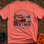 Canoe Venture Vibes - T-Shirt in Watermelon - A white camper van with a blue canoe strapped to its roof is parked on a...