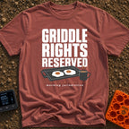 Griddle Rights Reserved - T-Shirt in Brick - The artwork features large stacked text reading "GRIDDLE RIGHTS RESERVED"...